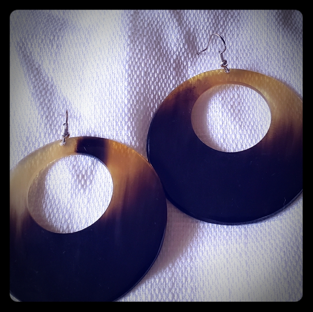 Round pair of cow horn earrings